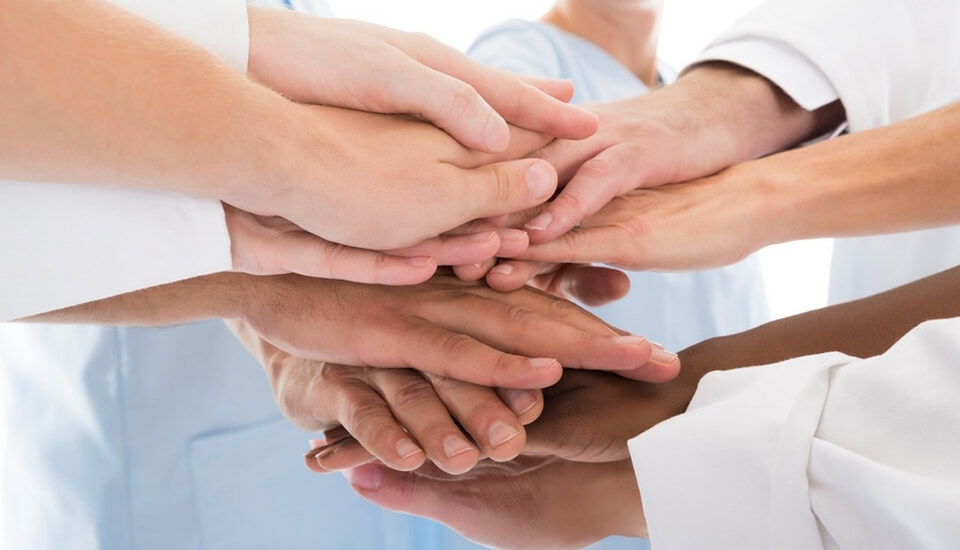Medical Team Stacking Hands